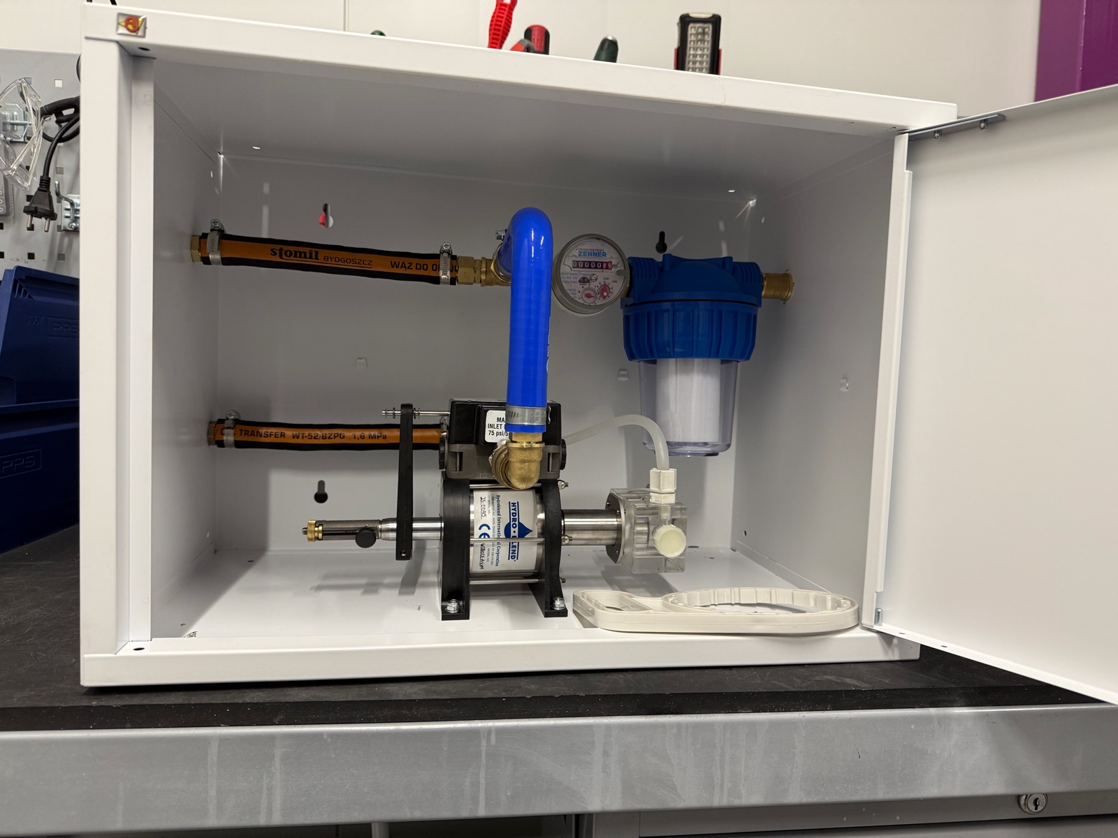 Hydroblend proportioner inside the turn-key mixing cabinet: water meter, filter and stainless-and-acrylic proportioner, pre-plumbed